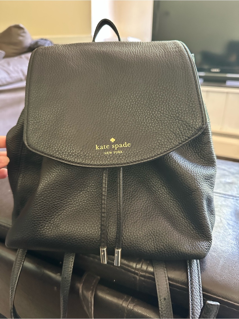kate spade Black Pebbled Leather Drawstring Backpack with Gold Logo